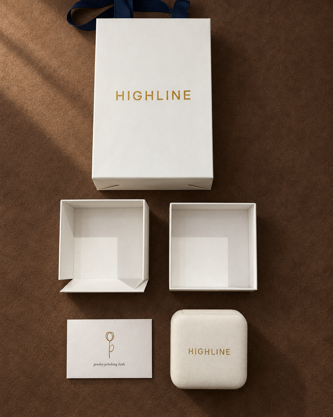 Gift bag, jewellery box, polishing cloth packet and two-part outer box