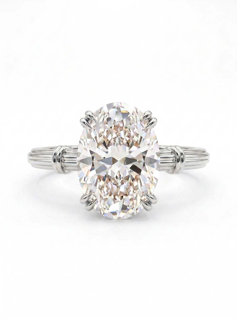 The Volute | Oval Solitaire with Double Prongs and Fluted Shank — worn view