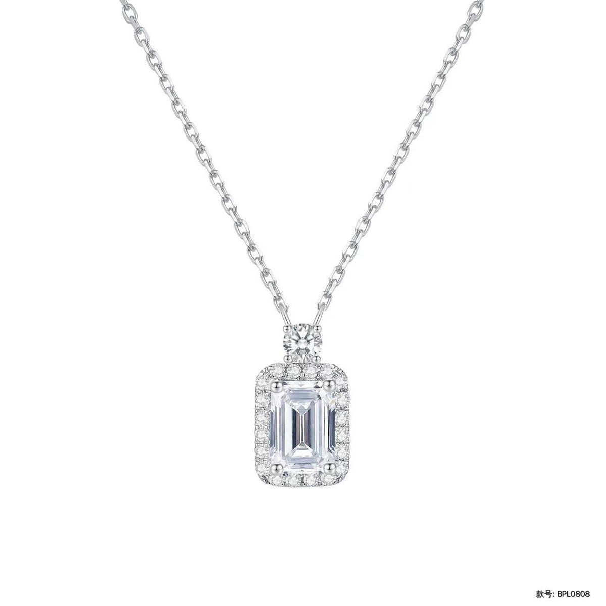 The Casement emerald-cut halo diamond pendant necklace with crowning round diamond — by Highline Diamond